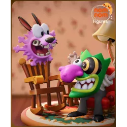 Gros plan sur la figurine de Courage, le chien rose,