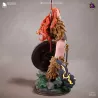 Figurine Nami One Piece en version guerrière barbare : fourrure, bouclier runique, épées et crâne flamboyant en base.