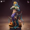 Link en tenue Gerudo, pose dynamique tenant deux melons et voile translucide bleu, détails dorés et expression déterminée.