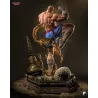 Figurine Sagat à peindre vue de dos, diorama temple en ruines avec stupas dorés