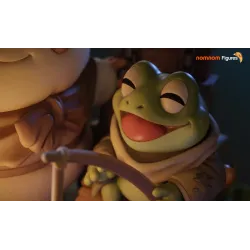Regardez ce sourire ! Zoom sur la petite grenouille installée sur son rondin, prête pour sa session de pêche.